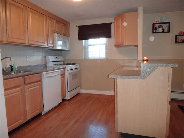 270 Main Street, Unit 2 North Reading, MA 01864 - Photo 4 of 7 a kitchen with a sink cabinets and wooden floor