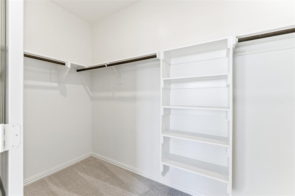 185 Brandywine Trail Rhome, TX 76078 - Photo 21 of 27 Walk in closet featuring light colored carpet