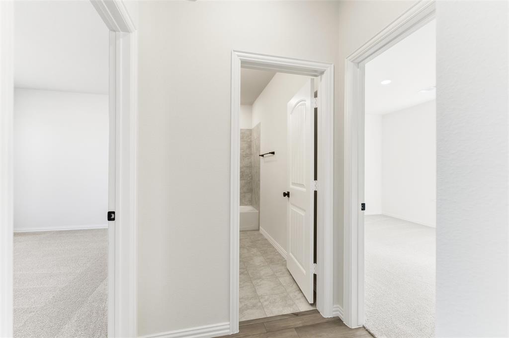 185 Brandywine Trail Rhome, TX 76078 - Photo 26 of 27 Hall featuring light colored carpet