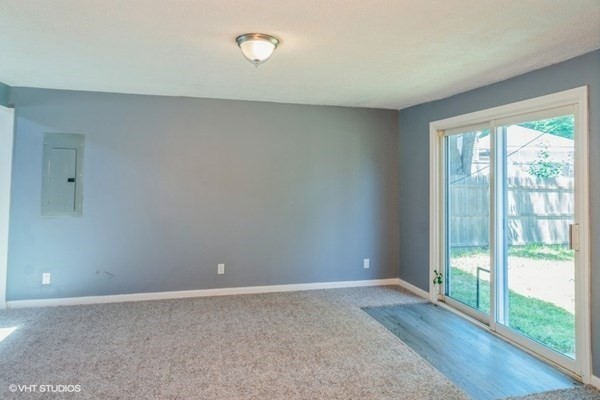 5 Dix Road Brockton, MA 02302 - Photo 12 of 15 a view of an empty room with wooden floor and a window