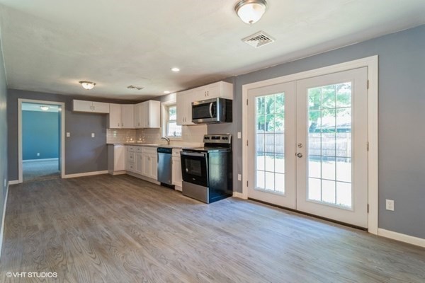 5 Dix Road Brockton, MA 02302 - Photo 6 of 15 a view of kitchen with wooden floor and electronic appliances