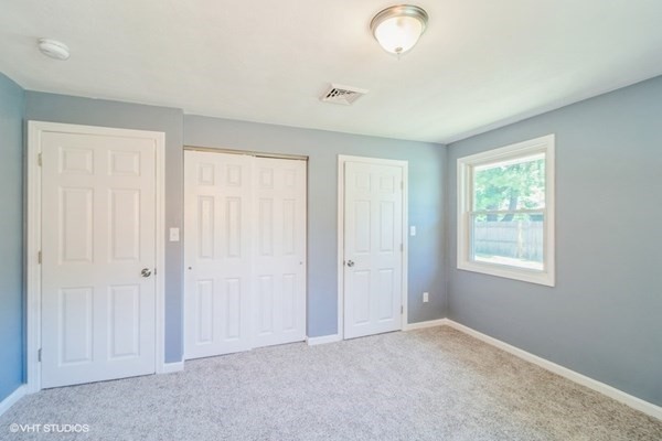 5 Dix Road Brockton, MA 02302 - Photo 9 of 15 an empty room with windows and closet