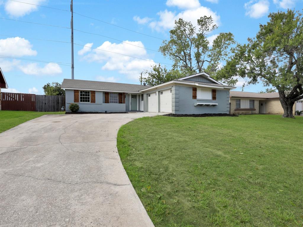 3109 Ridgedale Street Irving, TX 75062 - Photo 2 of 21 Ranch-style house featuring driveway and an attached garage