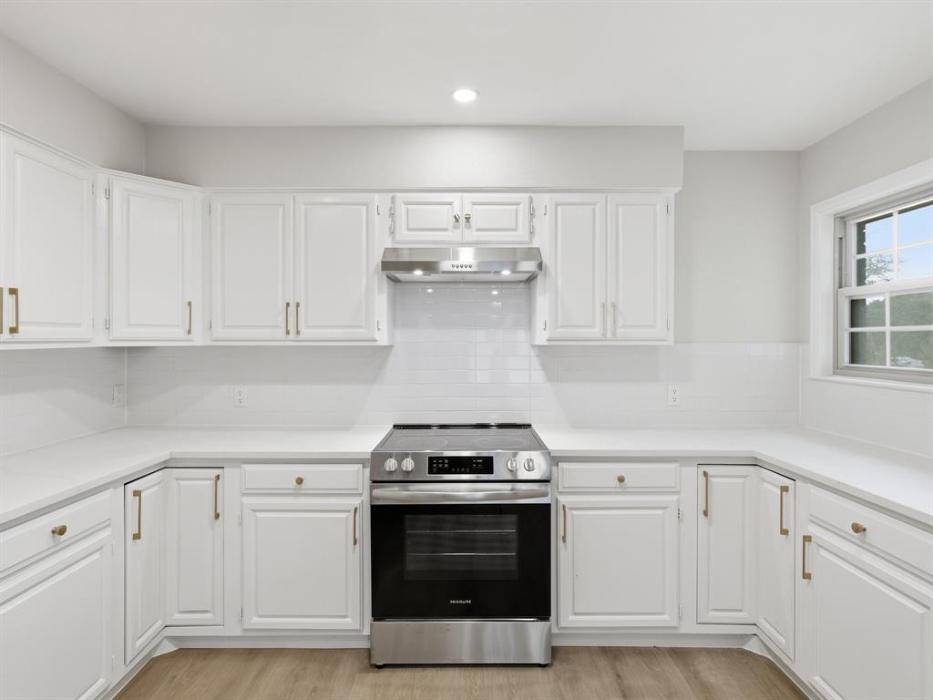 3109 Ridgedale Street Irving, TX 75062 - Photo 8 of 21 Kitchen featuring stainless steel electric range, white cabinetry, backsplash, and recessed lighting