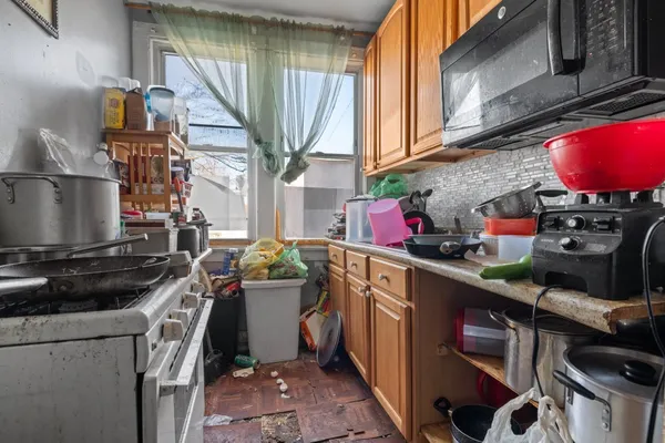 a kitchen with a stove and a sink