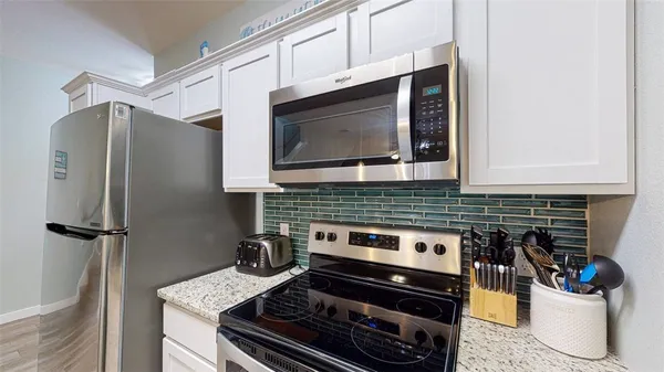 a kitchen with a stove and a microwave