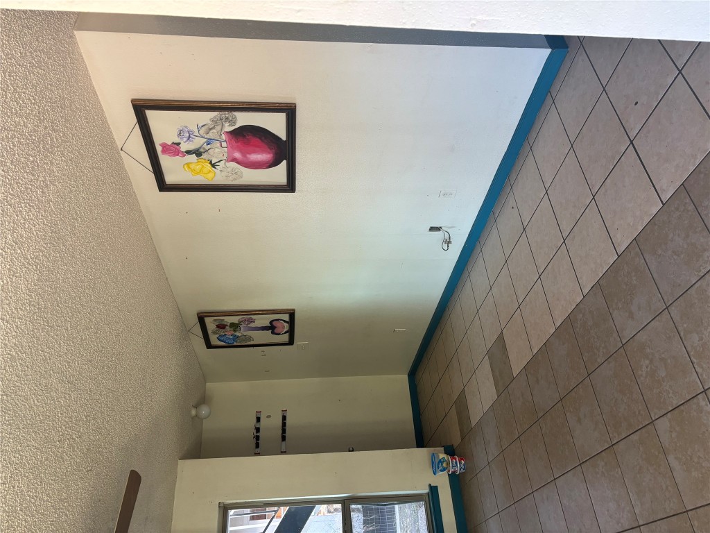 7926 Mullen Drive, Unit 1 Austin, TX 78757 - Photo 2 of 9 an empty room with windows