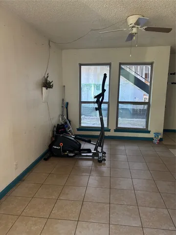 a room with gym equipment and a mirror