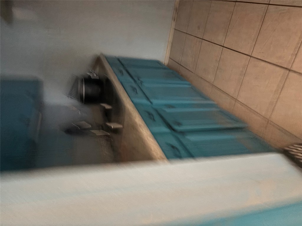 7926 Mullen Drive, Unit 1 Austin, TX 78757 - Photo 4 of 9 a kitchen with a sink and cabinets