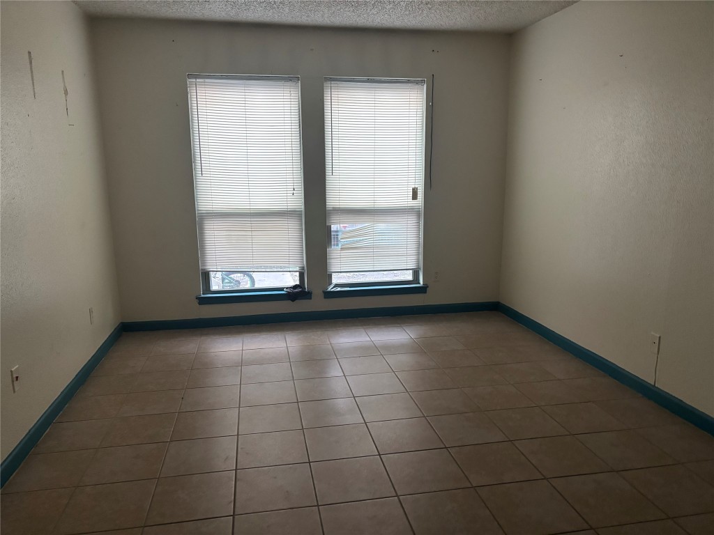 7926 Mullen Drive, Unit 1 Austin, TX 78757 - Photo 6 of 9 a view of an empty room with a window