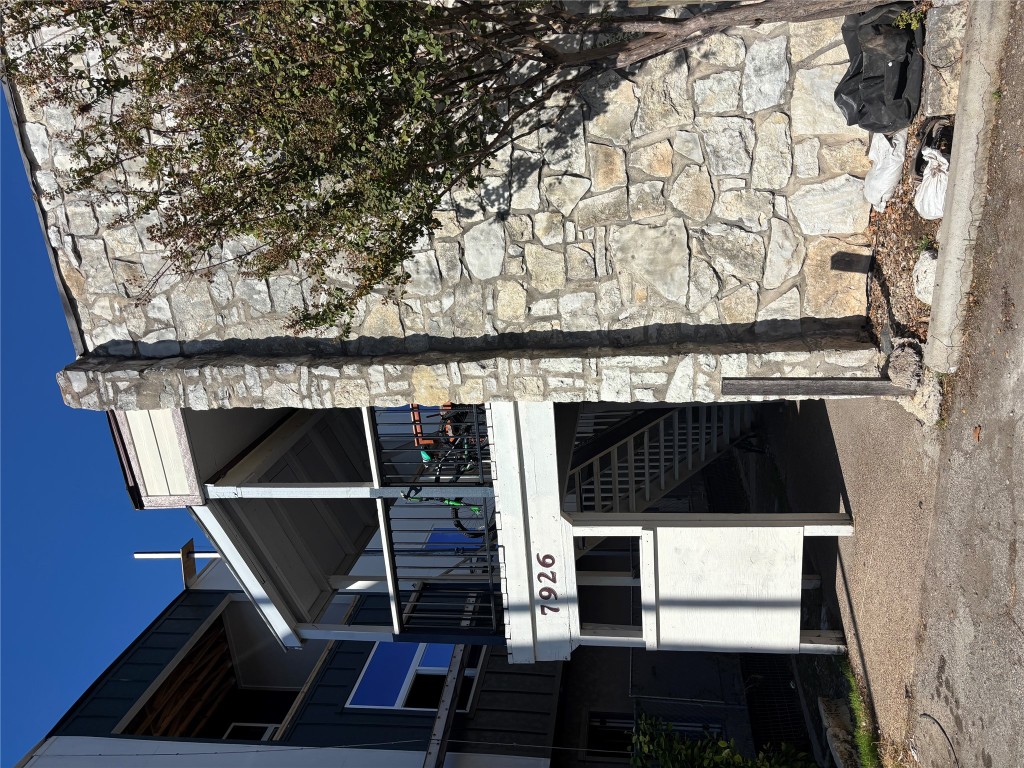 7926 Mullen Drive, Unit 1 Austin, TX 78757 - Photo 9 of 9 a front view of a building with an outdoor space