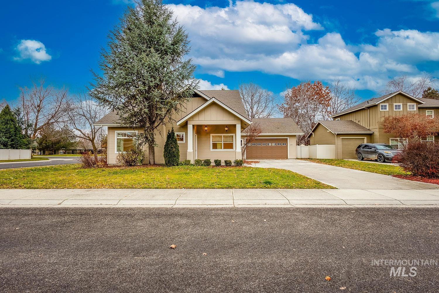 215 South Spring Lake Way Star, ID 83669 - Photo 2 of 50 View of front facade featuring roof with shingles and concrete driveway