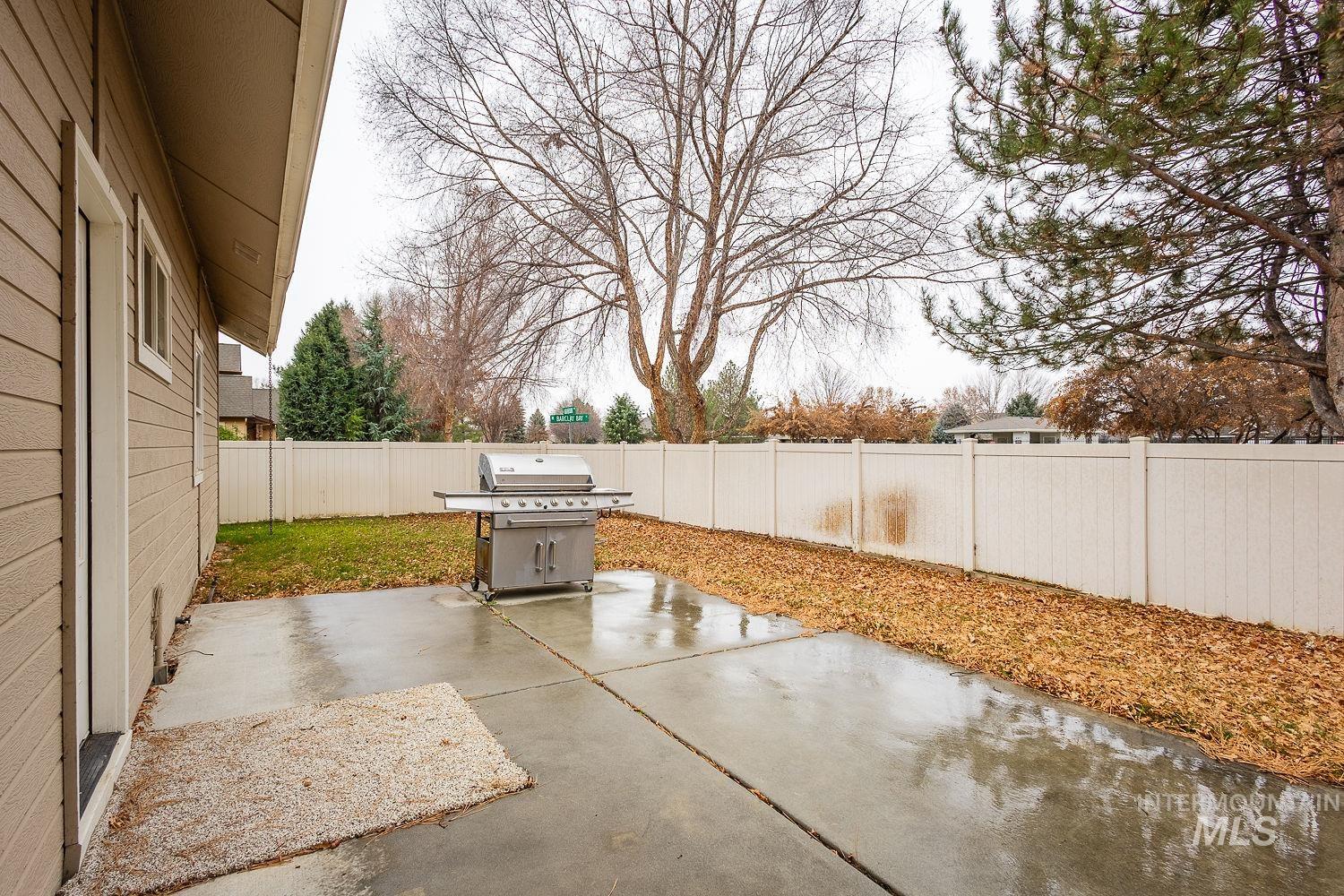 215 South Spring Lake Way Star, ID 83669 - Photo 39 of 50 Fenced backyard featuring a patio and grilling area