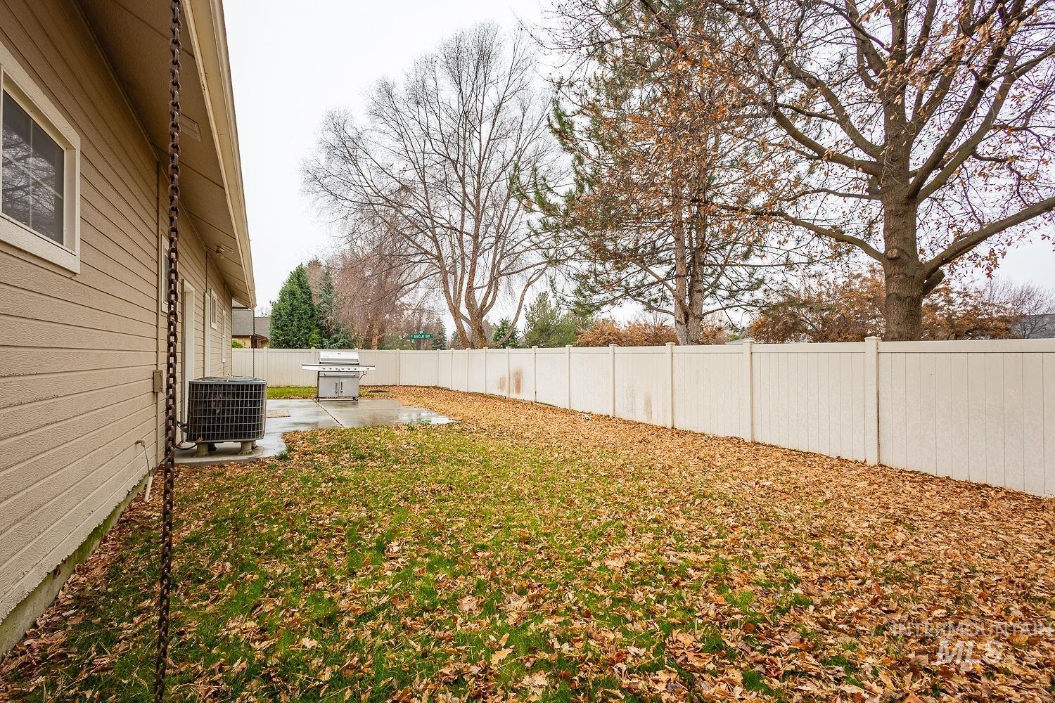 215 South Spring Lake Way Star, ID 83669 - Photo 44 of 50 Fenced backyard with a patio area