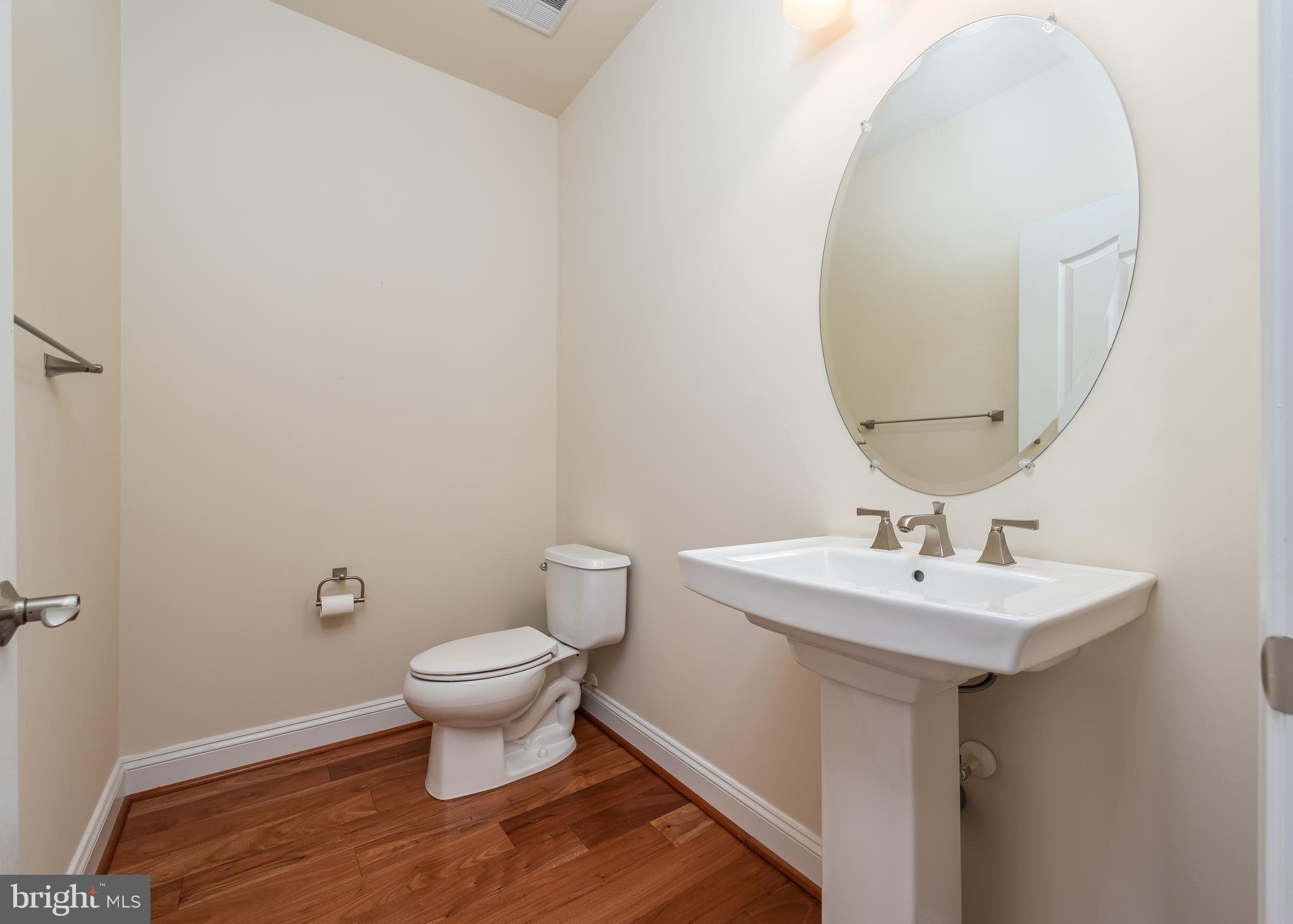 7662 Maple Lawn Boulevard, Unit 26 Fulton, MD 20759 - Photo 11 of 37 a bathroom with a sink toilet and a mirror