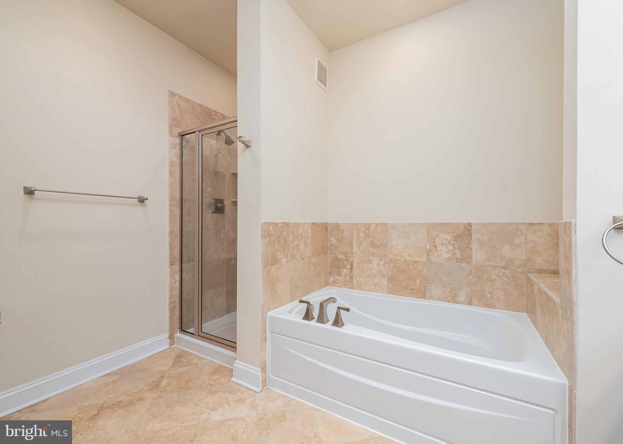 7662 Maple Lawn Boulevard, Unit 26 Fulton, MD 20759 - Photo 15 of 37 a bathroom with a bathtub and shower