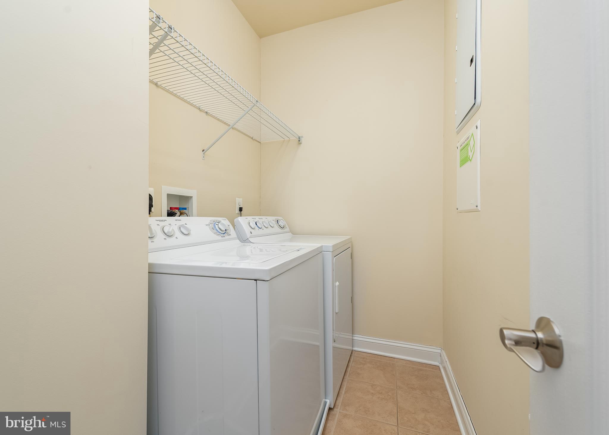 7662 Maple Lawn Boulevard, Unit 26 Fulton, MD 20759 - Photo 18 of 37 a utility room with dryer and washer