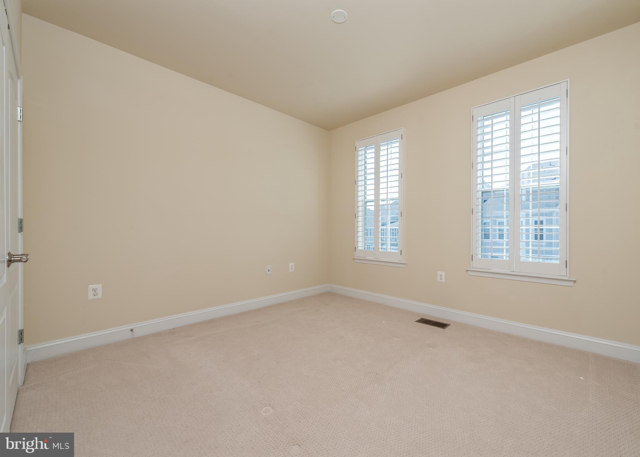7662 Maple Lawn Boulevard, Unit 26 Fulton, MD 20759 - Photo 19 of 37 an empty room with windows