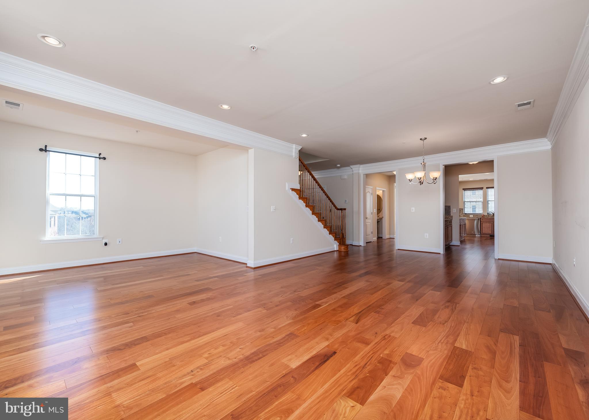 7662 Maple Lawn Boulevard, Unit 26 Fulton, MD 20759 - Photo 21 of 37 a view of empty room with wooden floor