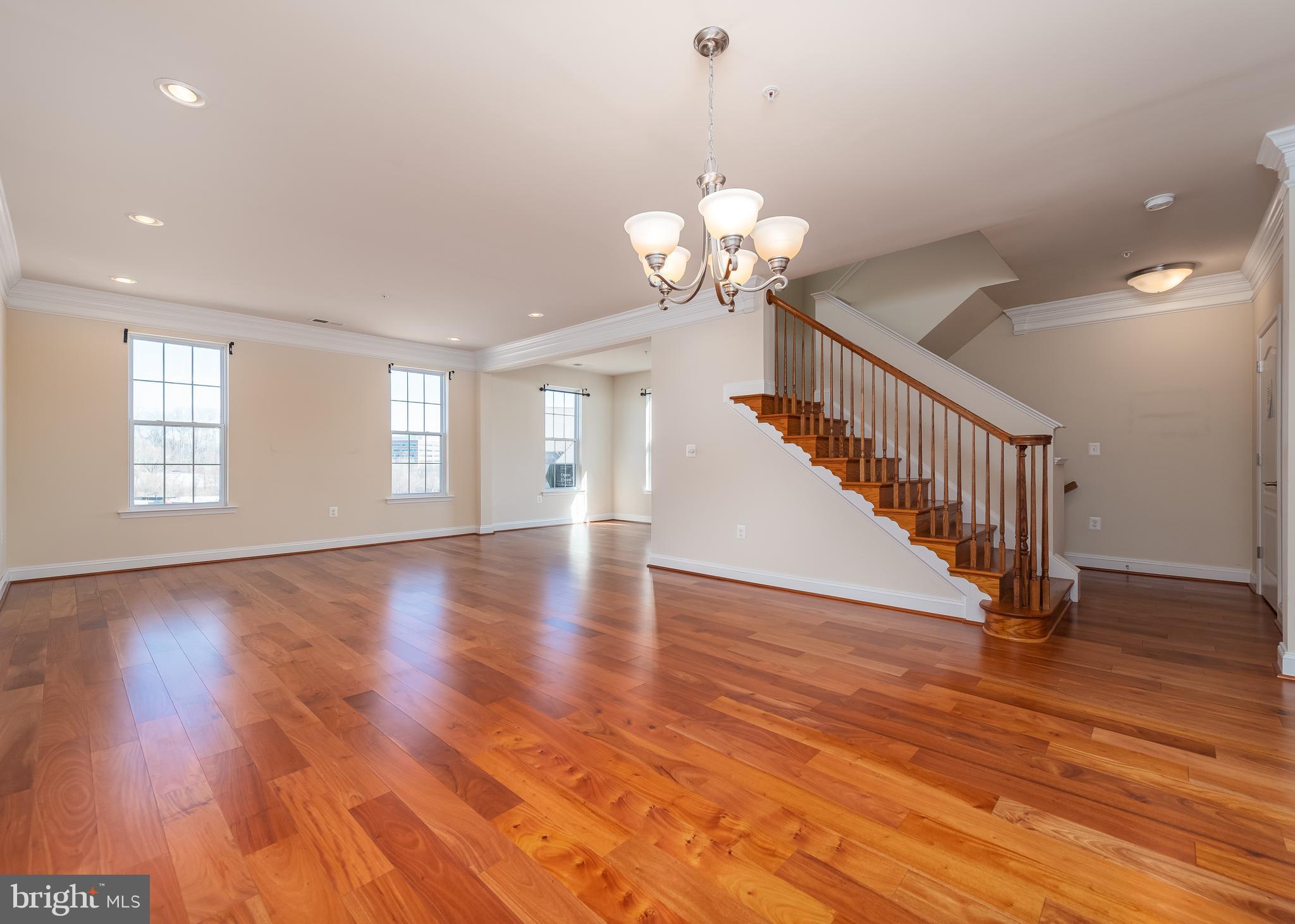 7662 Maple Lawn Boulevard, Unit 26 Fulton, MD 20759 - Photo 22 of 37 a view of an empty room with wooden floor and a window