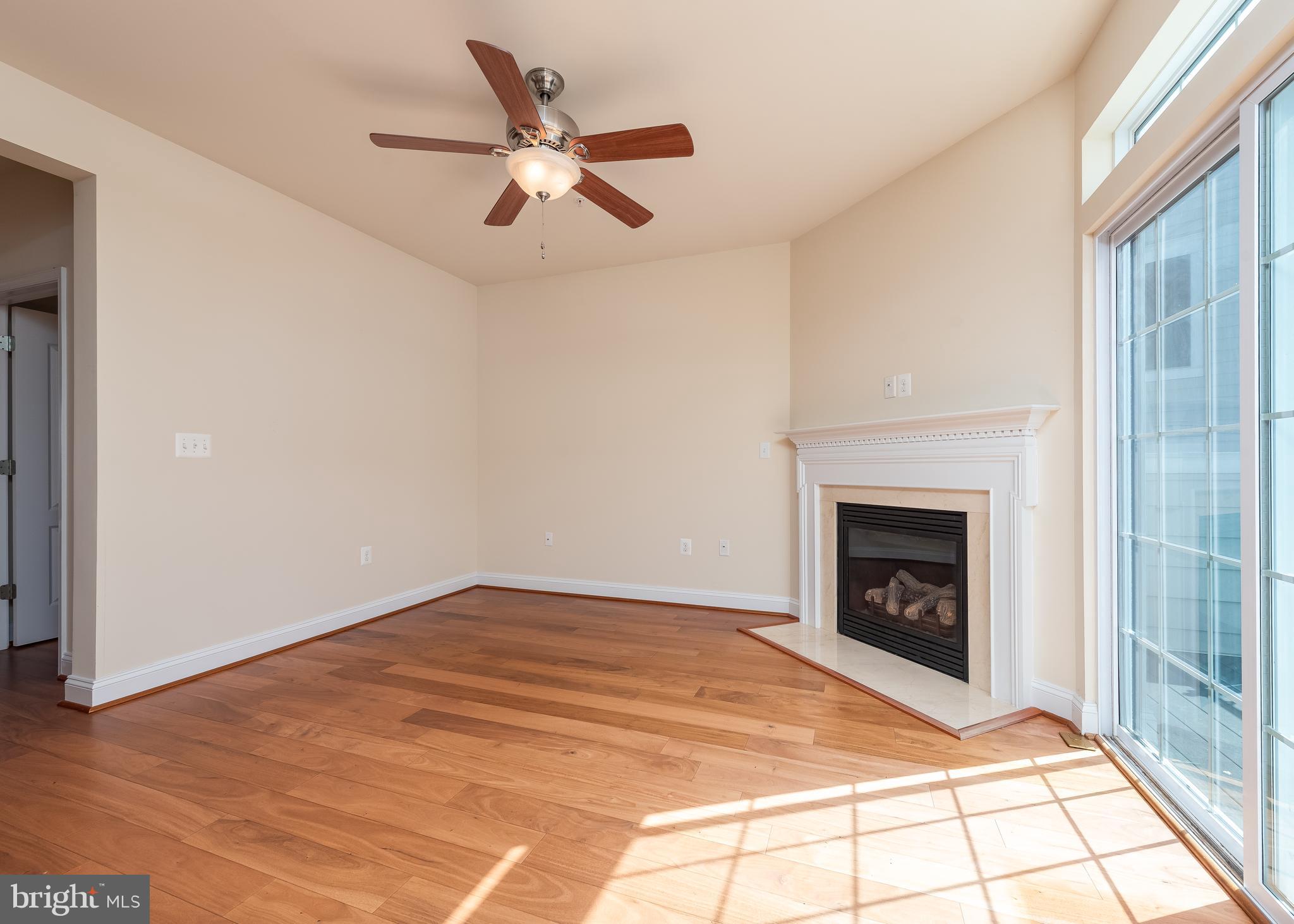 7662 Maple Lawn Boulevard, Unit 26 Fulton, MD 20759 - Photo 23 of 37 a view of empty room with fireplace and fan