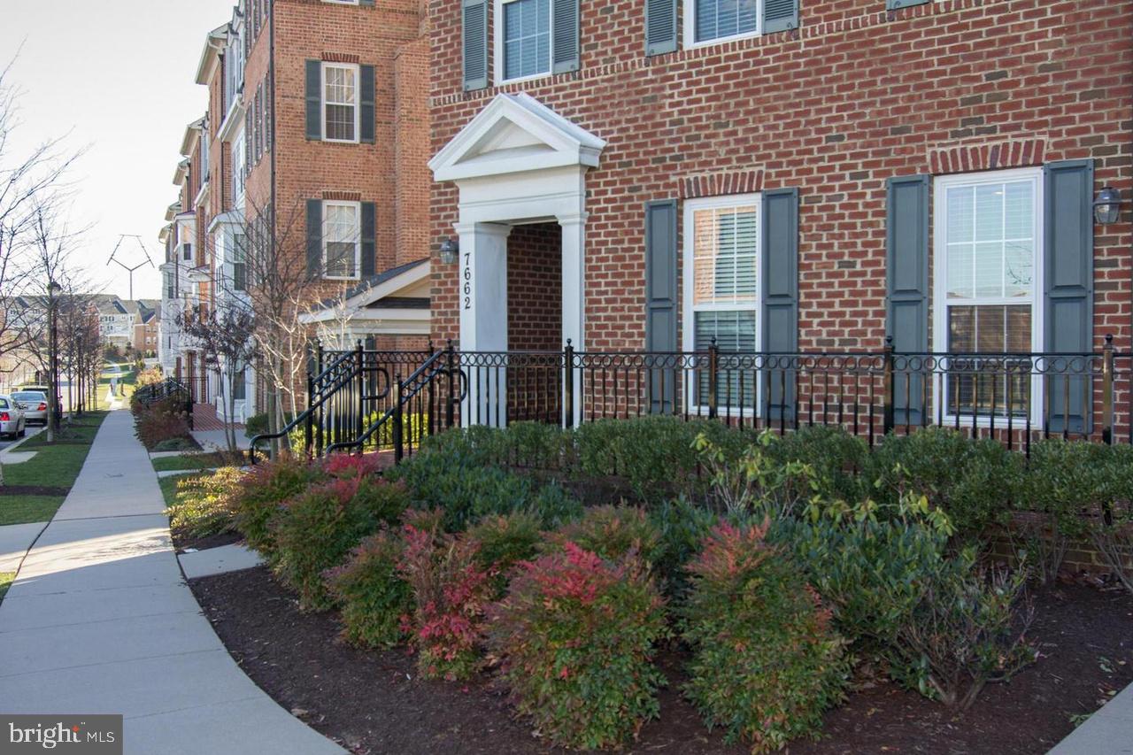 7662 Maple Lawn Boulevard, Unit 26 Fulton, MD 20759 - Photo 7 of 37 a front view of a house with a garden