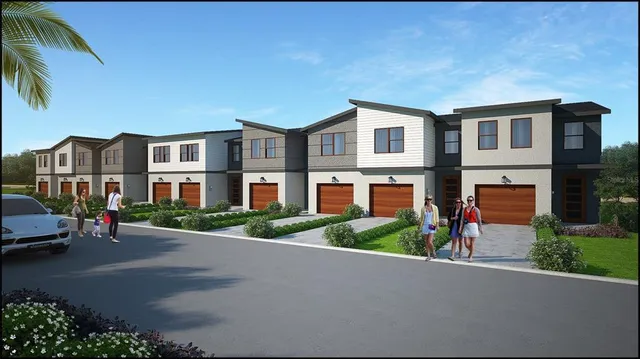 a view of multiple houses with a street