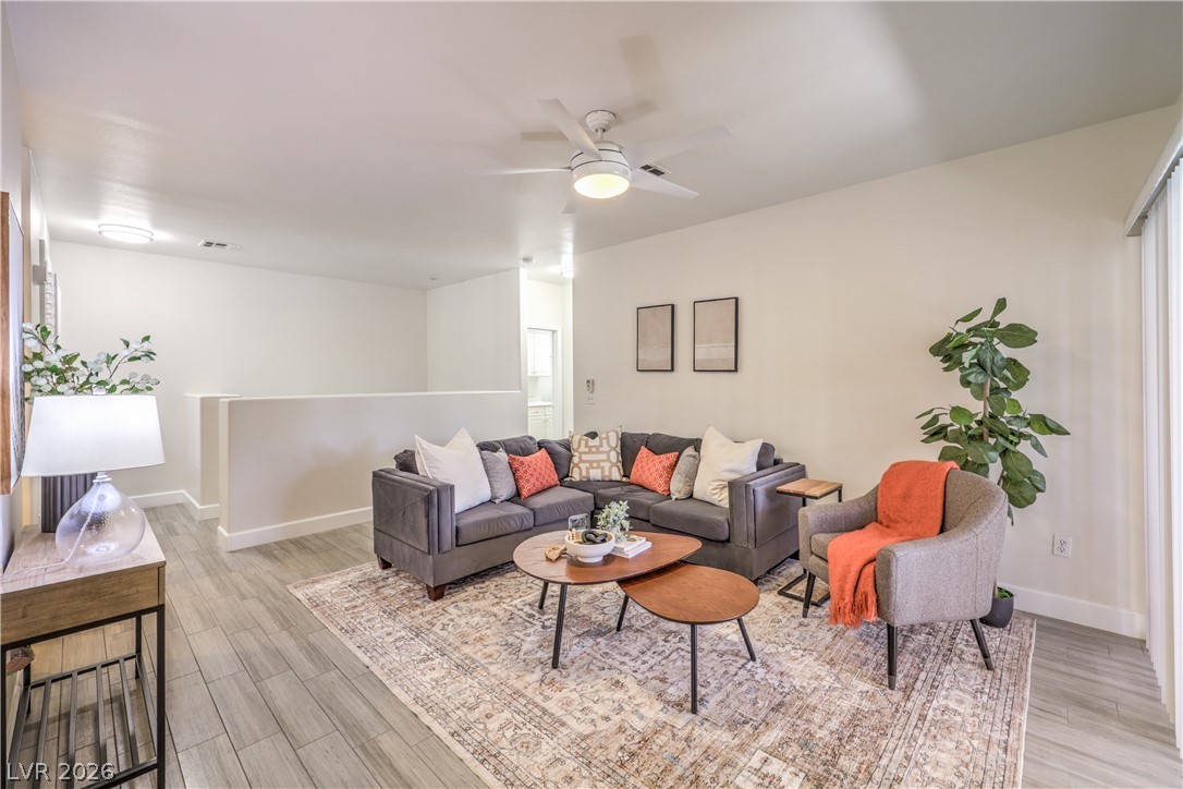 2050 West Warm Springs Road, Unit 1421 Henderson, NV 89014 - Photo 12 of 45 A relaxed living area boasts easy-care flooring and ample space for gatherings.