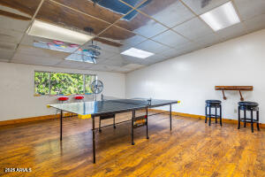 5829 East Buck Springs Road, Unit 140 Pinetop, AZ 85935 - Photo 15 of 37 a room with furniture and a wooden floor