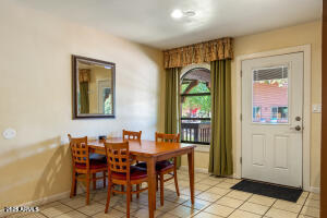 5829 East Buck Springs Road, Unit 140 Pinetop, AZ 85935 - Photo 23 of 37 a view of a dining room with furniture