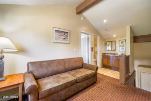 5829 East Buck Springs Road, Unit 140 Pinetop, AZ 85935 - Photo 33 of 37 a living room with furniture and kitchen view