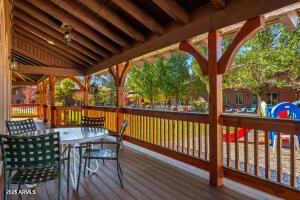 5829 East Buck Springs Road, Unit 140 Pinetop, AZ 85935 - Photo 37 of 37 a view of a chairs and table in the patio