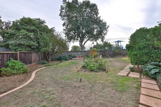 a backyard of a house with lots of green space