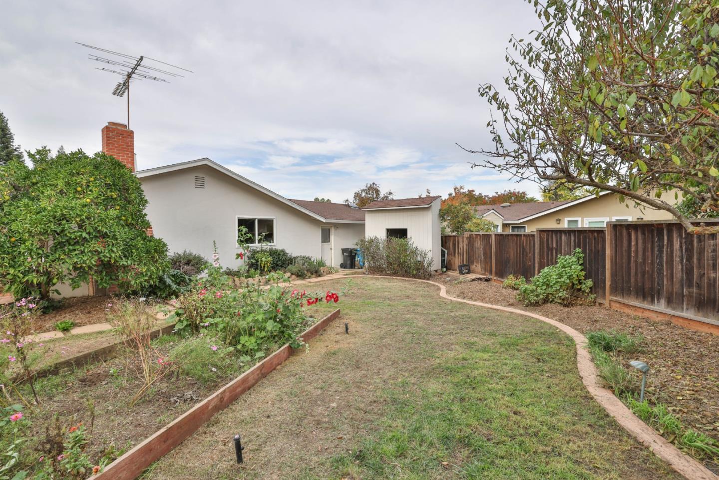 3772 Thrush Way Santa Clara, CA 95051 - Photo 20 of 21 a front view of a house with a yard and potted plants