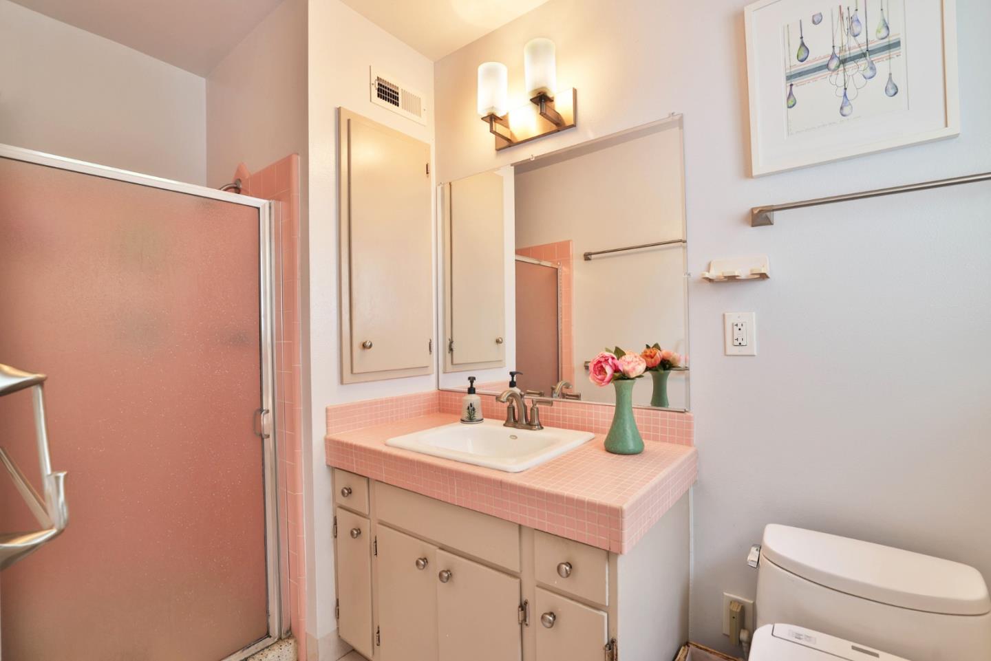 3772 Thrush Way Santa Clara, CA 95051 - Photo 10 of 21 a bathroom with a sink a toilet and a mirror