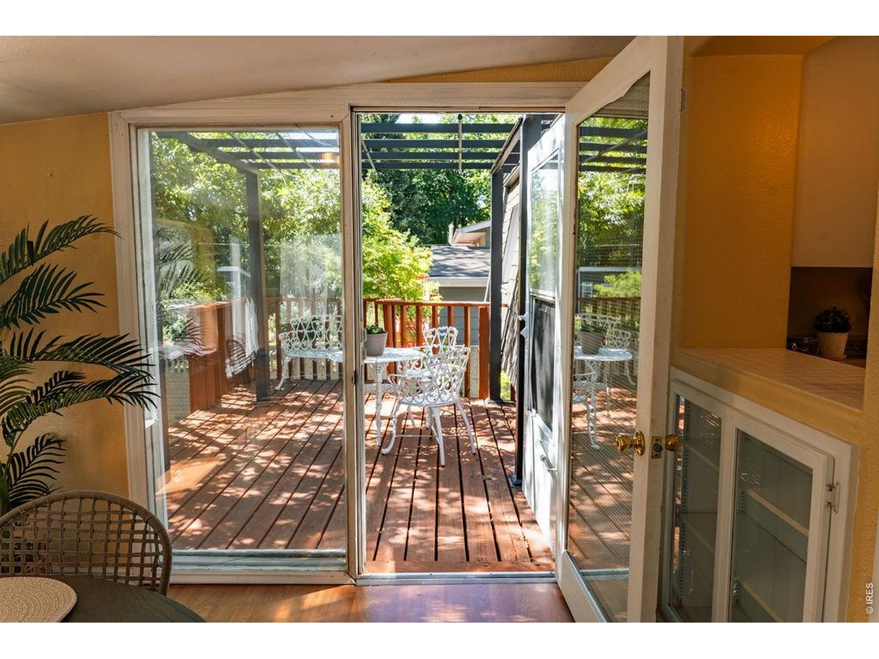 522 South Bryan Avenue Fort Collins, CO 80521 - Photo 17 of 43 Dining Area/Sunroom Door to Deck