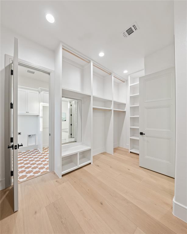 724 Cooper Trail Weatherford, TX 76087 - Photo 31 of 37 Custom closet system with extensive shelving and hanging rods