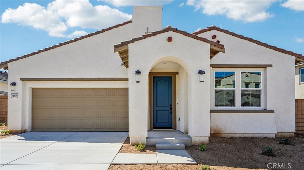 a front view of a house with a garage