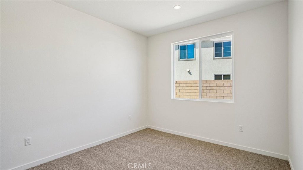 73578 Raphael Drive Palm Desert, CA 92211 - Photo 18 of 33 an empty room with a window
