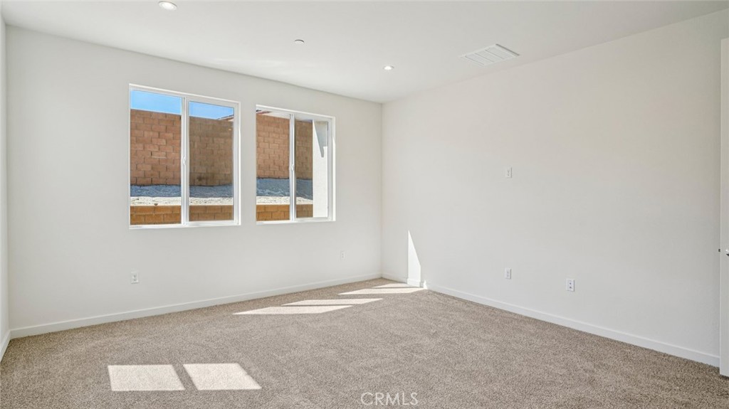 73578 Raphael Drive Palm Desert, CA 92211 - Photo 28 of 33 an empty room with a window