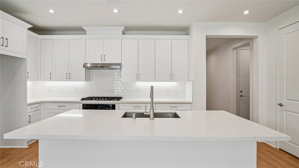 73578 Raphael Drive Palm Desert, CA 92211 - Photo 10 of 33 a white refrigerator freezer sitting inside of a kitchen
