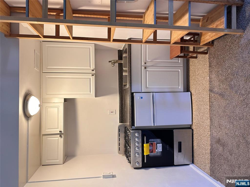 a kitchen with a stove and a cabinet