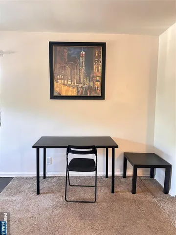 a view of a livingroom with furniture