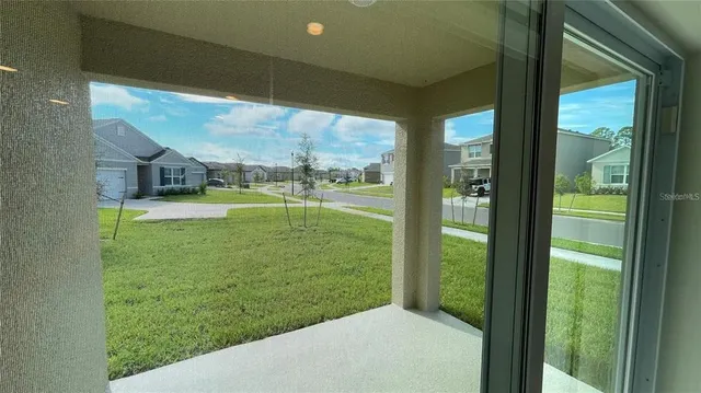 a view of an empty room and window