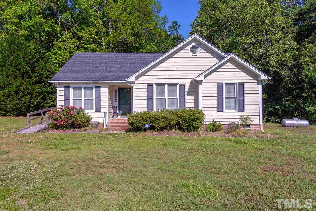 5110 Raleigh Road Benson, NC 27504 - Photo 1 of 24 a front view of a house with a yard