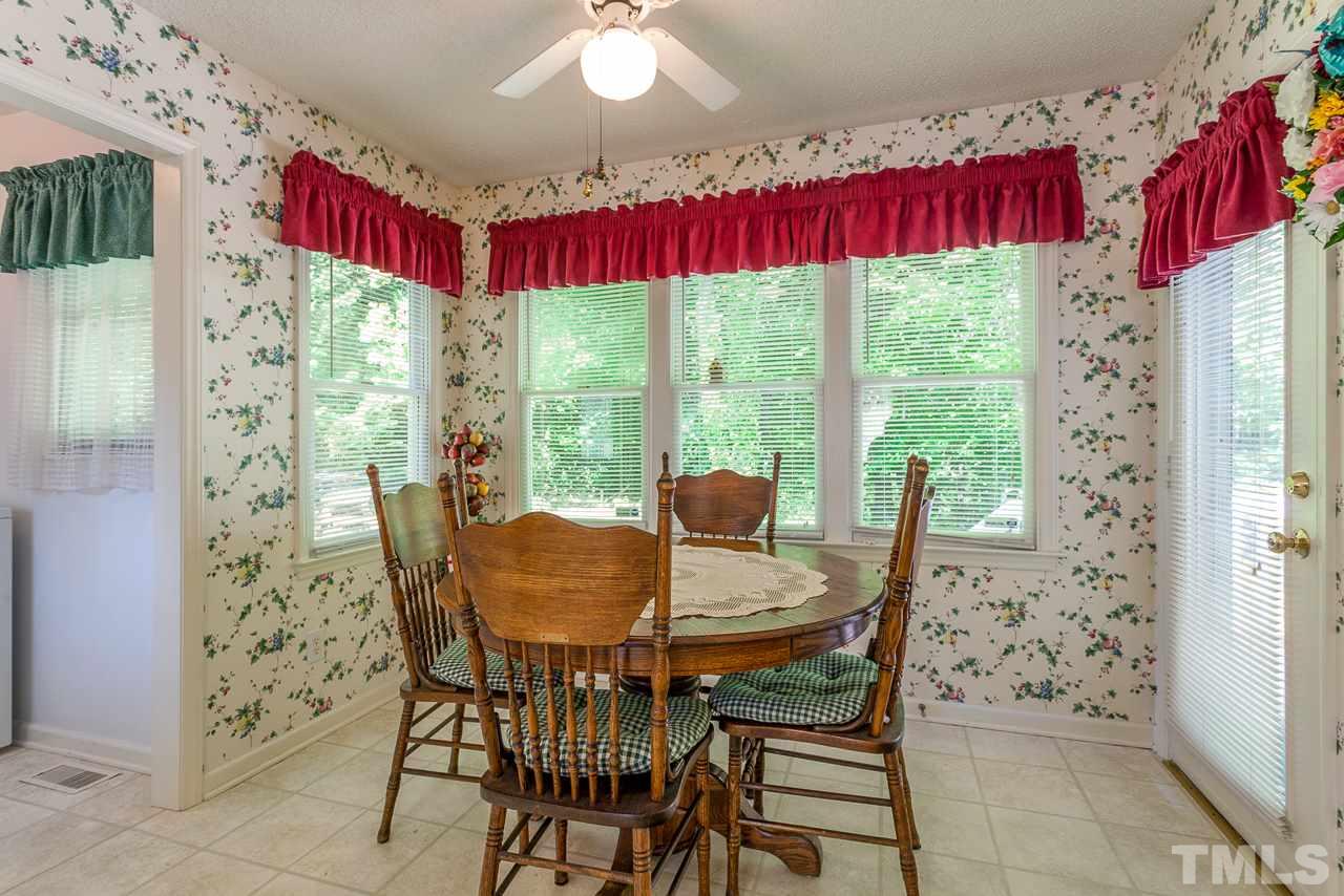 5110 Raleigh Road Benson, NC 27504 - Photo 8 of 24 a view of a dining room with furniture window and outside view