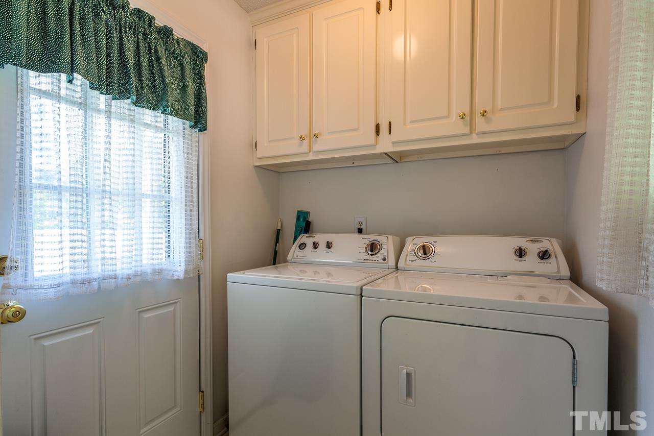 5110 Raleigh Road Benson, NC 27504 - Photo 9 of 24 a utility room with dryer and washer