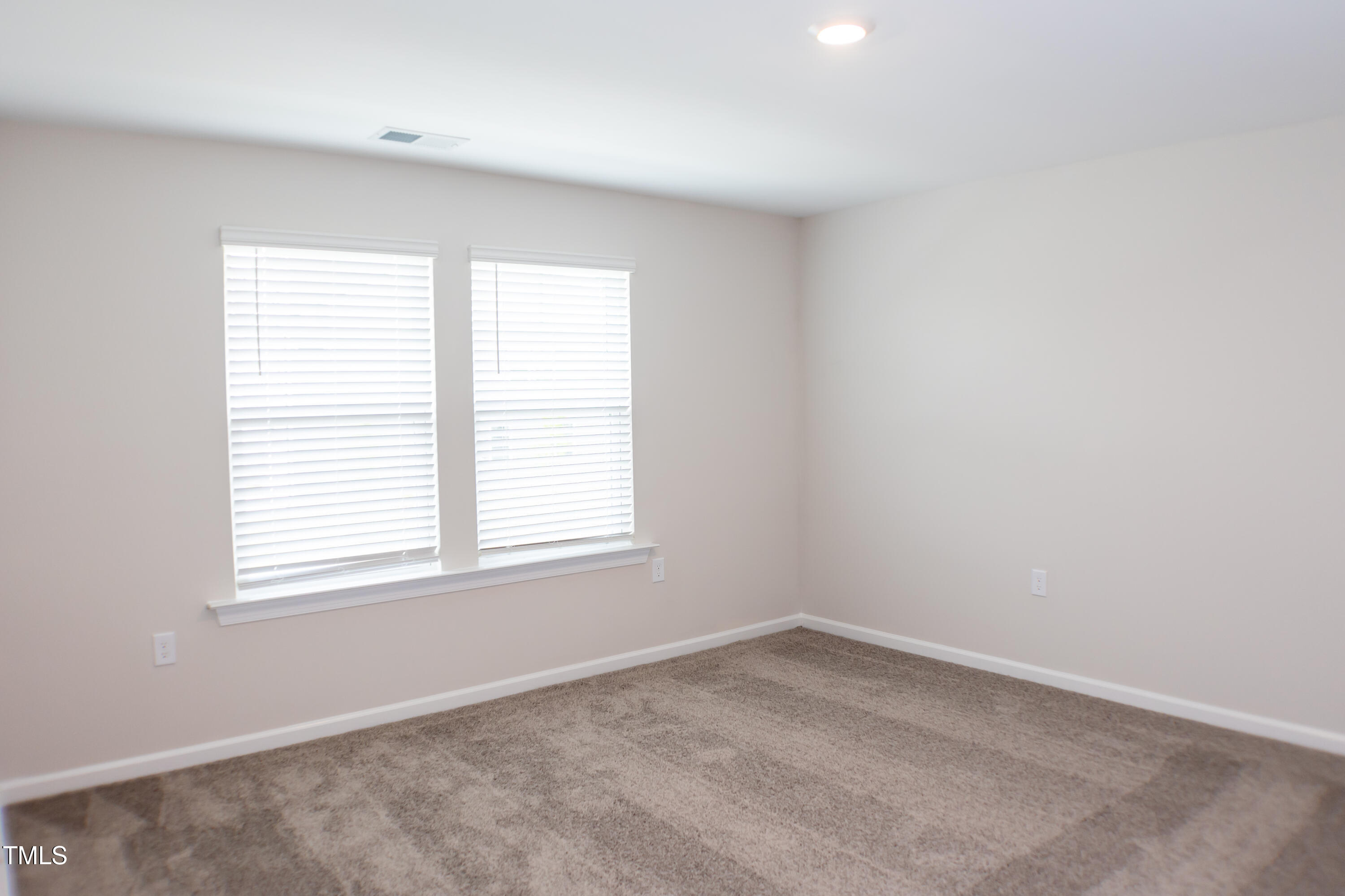 856 Patriot Summit Lane Apex, NC 27523 - Photo 13 of 25 an empty room with a window