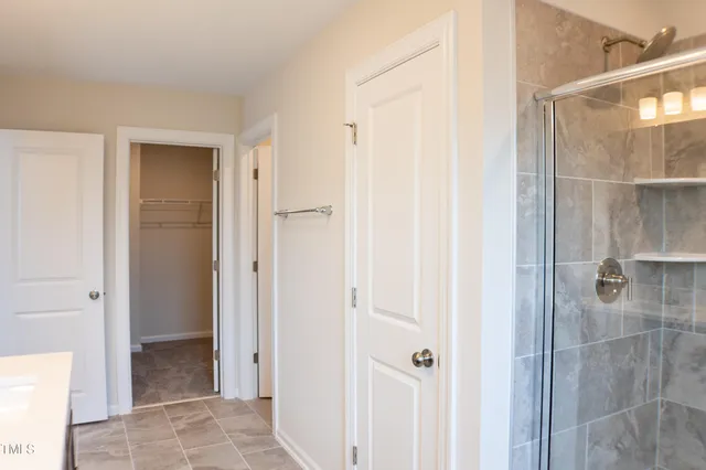 a view of a bathroom from a hallway