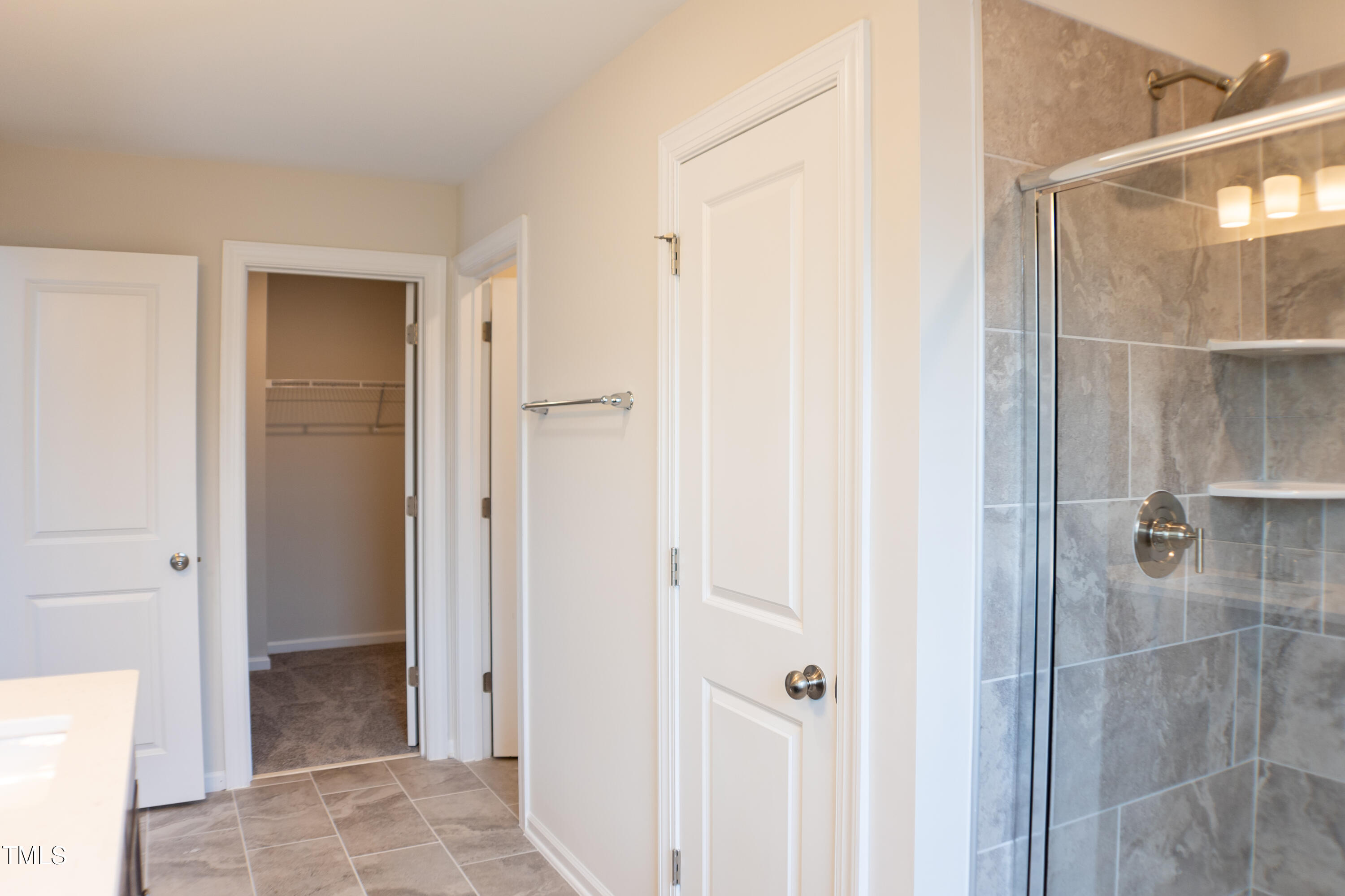 856 Patriot Summit Lane Apex, NC 27523 - Photo 16 of 25 a view of a bathroom from a hallway